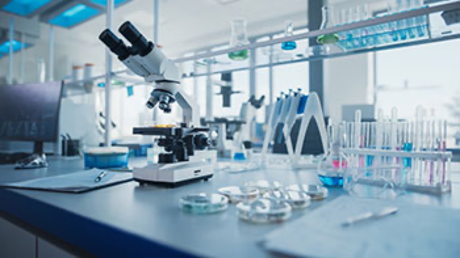 A research laboratory with microscope and scientific equipment representing the path to a Rett syndrome cure